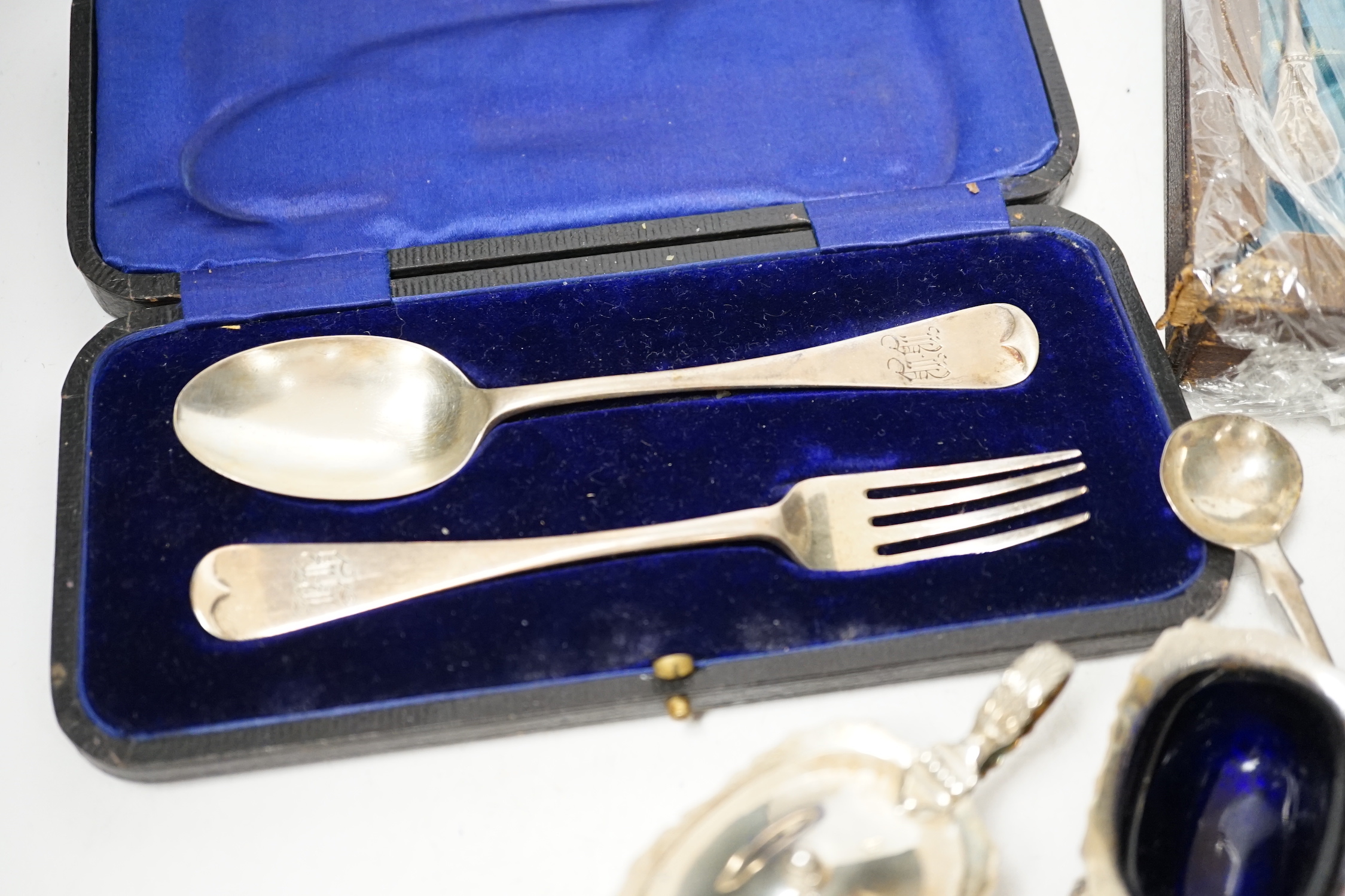 A group of assorted mainly small silver flatware, including 19th century, a small group of sterling spoons, a silver napkin ring and cased silver christening spoon and fork, etc.